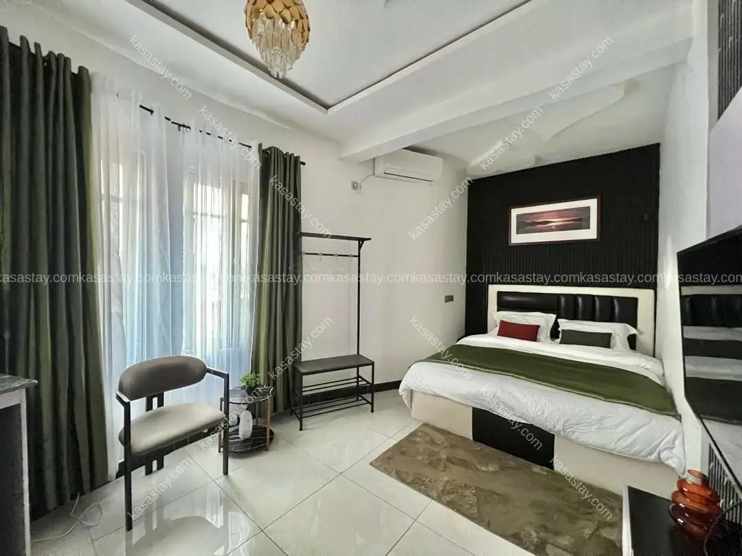Chambre 101 by résidence kingdom tower ( makepe à côté de la station Jeff oil)